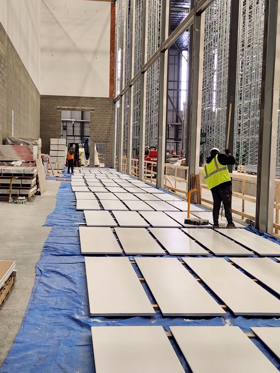 Warehouse construction area with workers